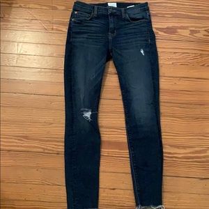 Hudson frayed hem mid rise stretch jeans.